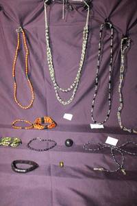 lot 295 image: (10) Magnetic Hematite jewelry selection. Includes a Hematite and Snowflake Obsidian necklace, Hematite sphere and Hematite eye glass holder
