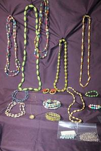 lot 310 image: (16) Artisan-crafted rolled book pagepaper bead jewelry selection. Includes beads from Thirty One Bits (Beads For Good).