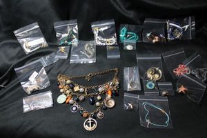 lot 319 image: Nautical themed jewelry selection. Includes dolphins, anchors, starfish, mermaids, and more. Includes earrings from J. Crew and Claires.