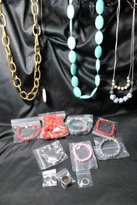 lot 320 image: Rubber or rubber clad jewelry selection. Includes Necklaces, bracelets, rings.