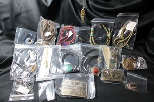 lot 324 image: Western jewelry selection. Includes bolo ties, belt buckles, concho belts, western-theme hand painted items, , etc.