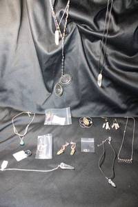 lot 317 image: New Age, fantasy and rock crystal jewelry. Includes a pair of artisan crafted silver wire and Amethyst crystal earrings, mood ring and more.