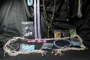 lot 335 image: (12) Glass micro bead necklaces. Varying styles and complementing materials