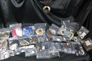 lot 251 image: Mother Of Pearl and Shell jewelry selection. Includes a silver incised tortoise shell pendant