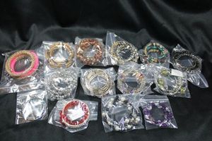 lot 252 image: (14) Wraparound spiral bracelets. Assorted colors, sizes and materials.
