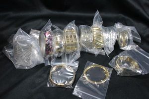 lot 256 image: (10) Hinged cuff bracelets. Assorted styles and designs