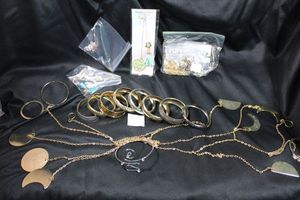 lot 257 image: (11) Metal bangle bracelets. Assorted styles and designs. Also includes a 55 moon phase wall art piece, 3 bookmarks & 8 eyeglass holders