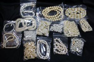 lot 263 image: (15) Pearl Selection. Includes Opera length faux pearl strand and more