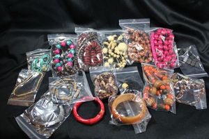 lot 269 image: (15) Wood jewelry selection.