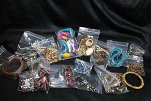 lot 270 image: (15) Wood jewelry selection.