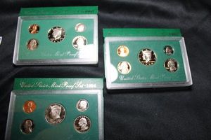 lot 406 image: Coins Proof Sets - (1) 1997, (1) 1998, (1) 1994