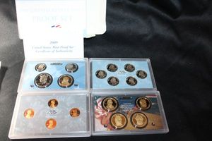 lot 414 image: Coins Proof Sets - (1) 2009 Lincoln one cent set, Presidential $1 Coin set, Proof set, and Quarter Set