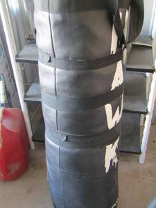 lot 11 image: Black Hawk punching bag filled with sand very heavy