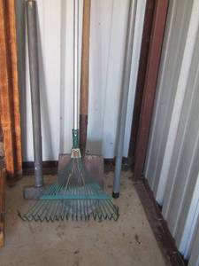 lot 28 image: Yard tools- rake- pole saw- shovel- sledge hammer