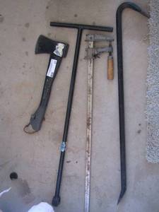 lot 37 image: T-post - crow bar- ax and a bar clamp