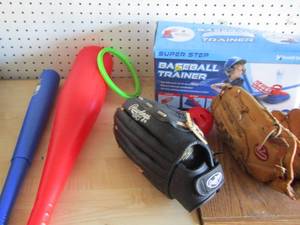 lot 30 image: Baseball trainer in original box has all pieces- 3 baseball gloves- red plastic bat