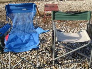 lot 17 image: Blue fold up camping chair, green tan fold up chair has small fold up table with cup holder