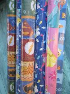 lot 81 image: New rolls of gift wrapping paper, various cartoons