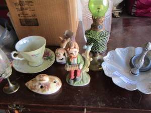 lot 104 image: Vase- small green glass oil lamp- tea cup and plate set- plus more