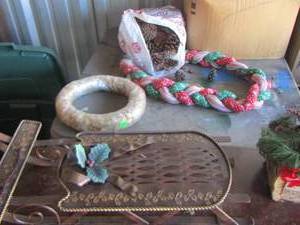 lot 135 image: Bag of pine cones- metal dcor sleigh, wicker wreath