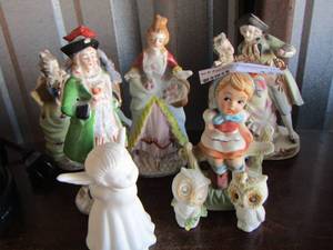 lot 142 image: lady and man figurines, white angel & owls