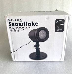 lot 231 image: Mini Snowflake Projector Light for IndoorOutdoor - In Condition As Shown - Retails New $37