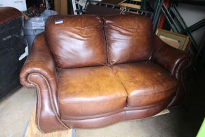 lot 15 image: Leather Loveseat made by Superb Creation Ltd. - 45L x 38H