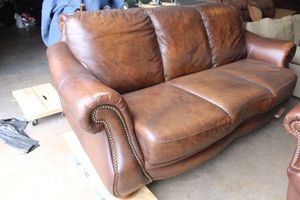 lot 17 image: Leather Couch made by Superb Creation Ltd. - 89L x 38H