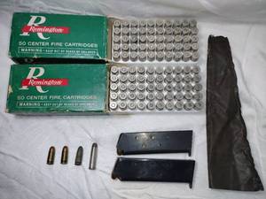 lot 29 image: Ammo - 2 full boxes of 45 automatic, 2 partial filled clips and misc. See photos.