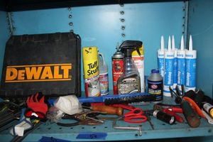 lot 56 image: Tools and DIY supplies Car cleaners, sealant tubes, ice scraper, empty Dewalt case
