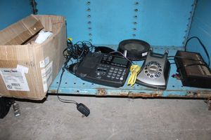 lot 57 image: Electronics Office phones and parts, clock radio, speaker. Plus soap bars and makeup