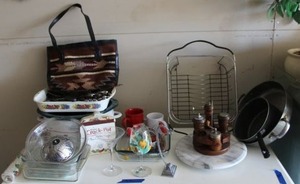 lot 87 image: Kitchen lot baking dishes, marble lazy susan, pans, wire dish dryer, knives and more