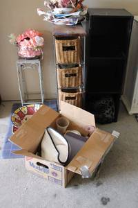 lot 95 image: Dishes and glassware, plant stand, wicker basket storage unit, flower arrangement