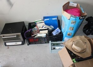 lot 97 image: Bags, VHS video and DVD movies, Cuisinart toaster oven, yarn, BRAZT bike seat
