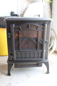 lot 101 image: Electric portable heater with fireplace design