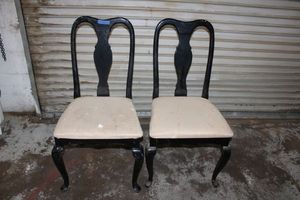 lot 100 image: Pair of black dining chairs as shown