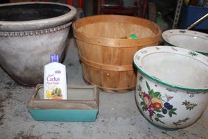 lot 104 image: Planters, bushel basket with birdseed, liquid Cactus food