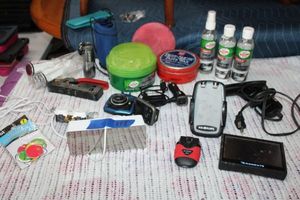lot 115 image: Misc. lot Alarm clock, car phone accessories, car wax, soldering gun