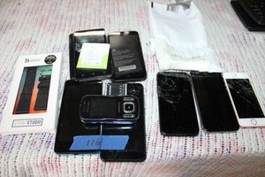 lot 116 image: Cell phones and iphones as is, Samsung watch band, see photos