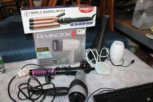 lot 118 image: Hair curling irons and blow dryers, air purifier, oil diffuser