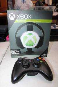 lot 120 image: XBox Light up Headphone stand (no headphones) Still in Box, and game controller