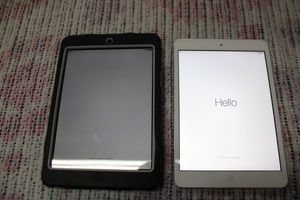 lot 127 image: (2) Apple iPads as is. One has case
