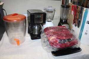 lot 145 image: George Foreman grill (appears new), pitcher dispenser, coffee maker and blenders
