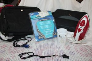 lot 149 image: Laptop travel bags, clothes iron, and stainless steel washer hoses