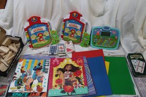 lot 155 image: Electronic learning toys, folders, Jenga blocks, cards and Dominoes