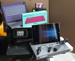 lot 4 image: Microsoft Surface Pro 3  with Purple Keyboard Case, extra keyboard, Printer, and paper, Purple Nikon Camera