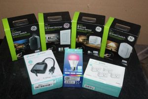lot 5 image: Home Smart Devices, Unopened GE 2 Wave Outdoor and Indoor Smart Switch, Smart Dimmer, and Smart Motion Sensor and Kasa Smart WiFi Mini Plug, Light Bulb and Outdoor Plug
