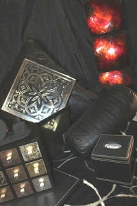lot 10 image: Home Dcor Items Black area rug with white circle 64x46, Black Leather Square Pillow 25x25, Long  Black Tube Shaped Pill 16 long, Apothecary Style Jewelry Box