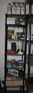 lot 30 image: Black Metro Rack with Contents, Eight (8) Shelves 18x18, Metro Rack is on Casters. Buyer must bring own boxes and help to disassemble shelf