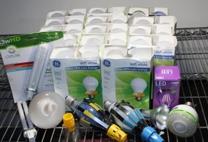 lot 47 image: Variety of light bulbs and tools that remove light bulbs
